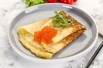 Russian pancake with red caviar