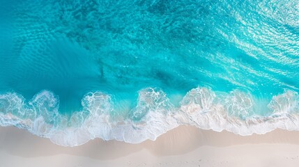 Fototapeta na wymiar From above, waves crash against the sandy beach, submerging a surfboard