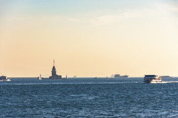 Maiden's Tower silhouette against golden sunset in Istanbul, perfect for travel and postcard design. Istanbul, Turkey (Turkiye)