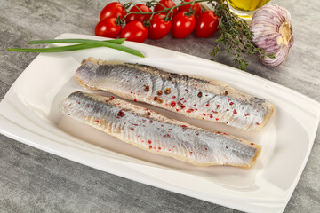 Marinated herring fillet with green onion