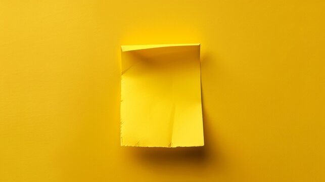   A yellow square paper, folded from a flat form, rests atop a yellow background One corner is missing
