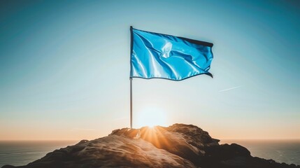   A blue flag atop a mountaintop Sun shines over ocean below Plane in sky