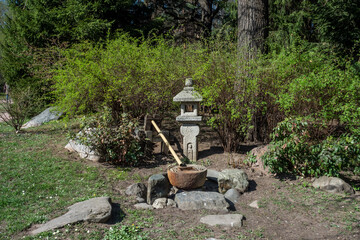 Traditional bamboo Japanese fountain and lantern