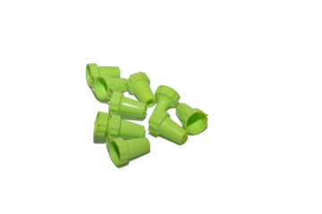 Background PNG. Removable green plastic nozzles for a pastry syringe.
