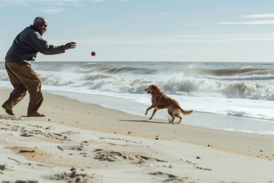 A senior African American man plays fetch with his dog on a beach.