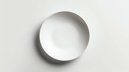 Top view of an empty white bowl on a white background. The bowl is perfectly centered and the image is well-lit.