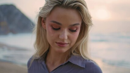 Romantic girl posing sunset at ocean shore closeup. Gentle smiling woman looking