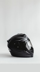 Modern black motorcycle helmet on white background