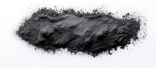 Pile of dark powder on white surface