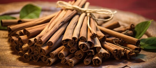 Close-up of cinnamon sticks on table - Powered by Adobe