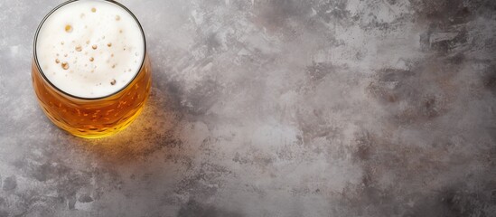 Glass of beer on a table - obrazy, fototapety, plakaty