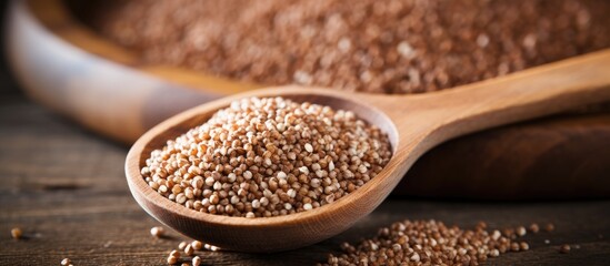Wooden ladle with overflowing brown grains