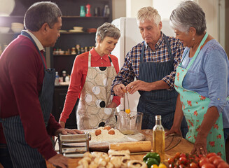 Cooking, food and senior friends in kitchen with recipe for bonding, talking and conversation in...