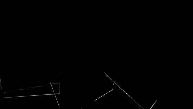 Broken glass on a black background. Glass breaking. Broken glass shard. Flying glass shards.