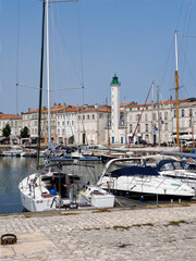 Marina and Lighthouse white and green of La Rochelle in France, region Poitou Charentes, Charente Maritime department