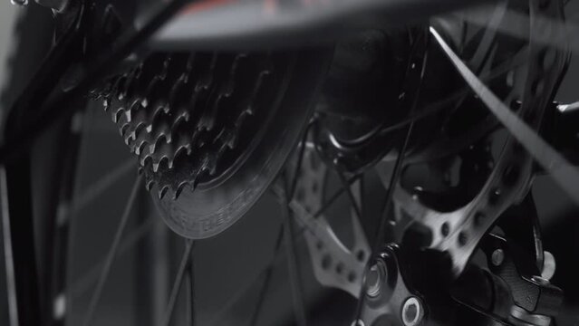 Cyclist On Bicycle Drivetrain System Chain Rotating. Gear System Bike Wheel. Cycling Drivetrain Derailleur Chain Cassette Spokes. Cyclist Chain Gear Shifting. Cycling Cranckset Bike Wheel Gearshift