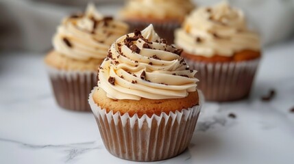Delicious cupcakes with chocolate frosting on table, closeup - obrazy, fototapety, plakaty