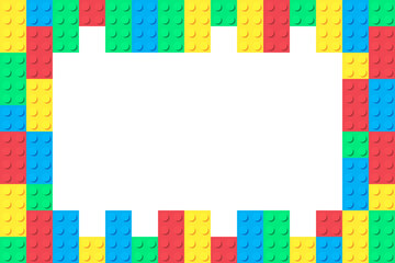 Frame of colorful toy bricks. Colored plastic construction blocks combined into frame with white empty copy space. Vector illustration.