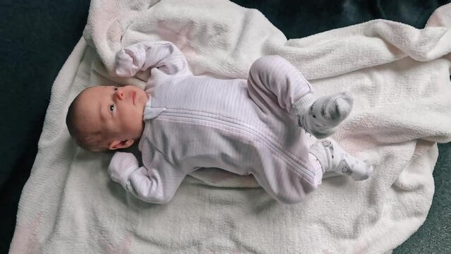 Newborn baby moving its feets and hands