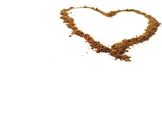 Medium roast coffee powder in heart shape with copy space for design. Concept image

