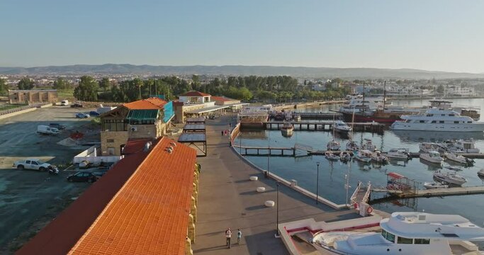 Aerial view of the port and marina in Pathos, Cyprus. Beautiful boats moored to the seashore on an island in the Mediterranean Sea. High quality 4k footage