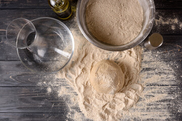 Top view of ingredients for making dough in the kitchen. Kneading dough for baking baked goods or...