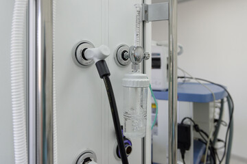 Medical ceiling surgical console in the operating room. Gas outlet for supplying oxygen in the intensive care unit. Anesthesiologist's workplace. Oxygen equipment operates during surgery.
