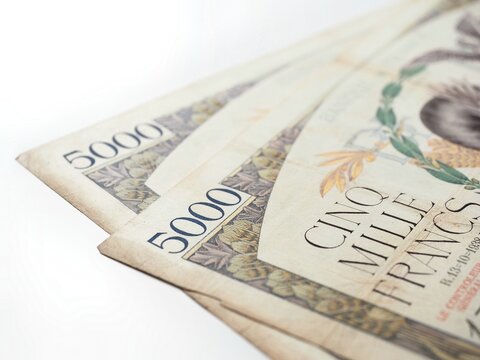 Close-up of two old five thousand 5000 french francs banknotes isolated on a white background 