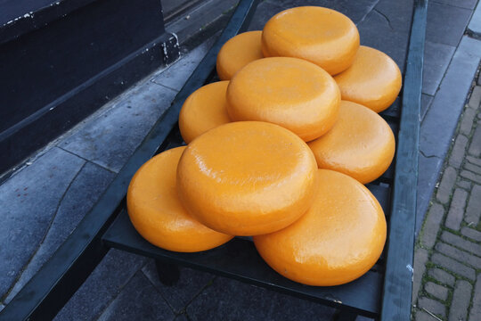 Whole round cheeses for sale at market square in Delft, Netherlands