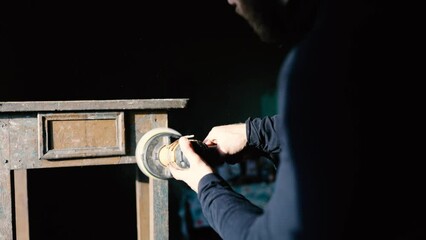restoration of antique vintage furniture bedside table, sanding solid wood.