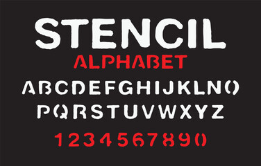 set of letters and numbers of the latin alphabet. Font stencil with white and red paint on black backdrop