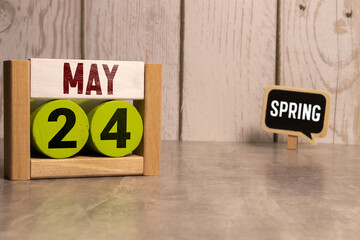 May 25th. Wooden cubes with date of 25 May on old blue wooden background.