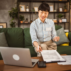 Mature japanese woman read document and work from home