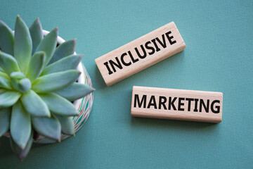 Inclusive Marketing symbol. Wooden blocks with words Inclusive Marketing. Beautiful grey green...