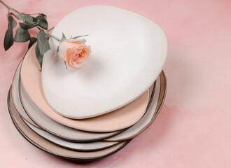 rose on pink and white plates