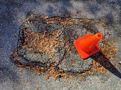 Orange Traffic Cone on Pavement