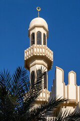 Minaret of the mosque against blue skies in Abu Dhabi, UAE