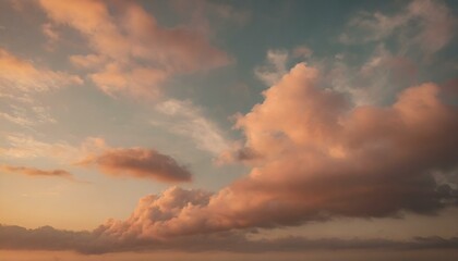Naklejka na ściany i meble soft pink clouds in a serene sky possibly at sunrise or sunset with a dreamy feel