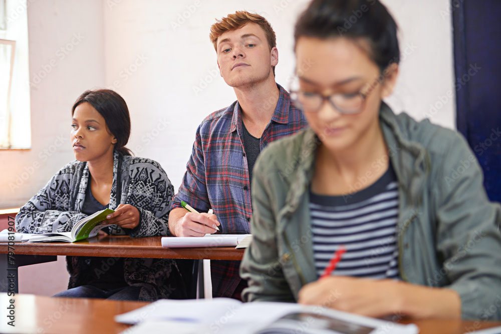 Poster university student, man and copying test in classroom with reading, question paper and answers at ca