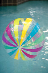 Giant beach ball in pool, verticle