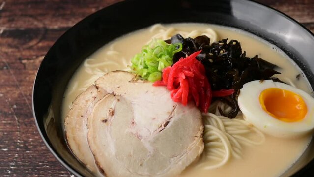 Japanese Tonkotsu style ramen in black bowl