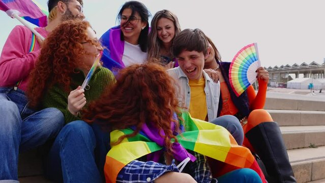 Happy group of gay people having fun celebrating together LGBT pride festival day. LGBTQ community concept