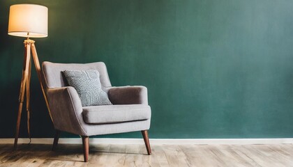 living room with gray armchair on empty dark green wall background