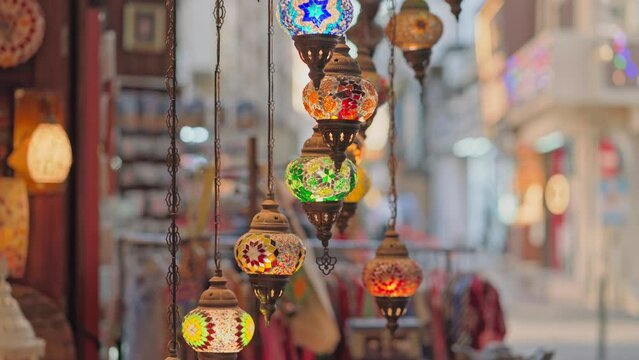 Manama, Bahrain- Jan 15 2024, 4k, Close-up view of multicolored antique glass lamps and lanterns with patterns, in souvenir shop, at Souq Bab Al Bahrain, at daytime, Manama, Bahrain 