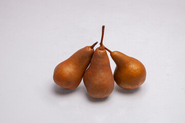 Three Ripe Pears Ready to Eat on White Background