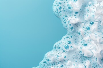 Close-up of blue foamy soap suds on a clean surface - obrazy, fototapety, plakaty