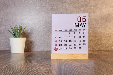 26 Mai on wooden grey cubes. Calendar cube date 26 May.