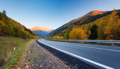 highway in mountains in autumn evening