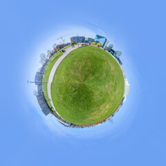 panorama of Spreebogen park in Berlin with government buildings in Berlin in early morning light in tiny planet format