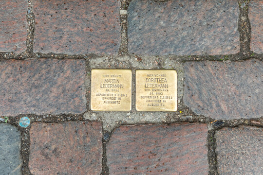 Stolpersteine project, stumbing stones on the pavement in front of former home of family Hainebach